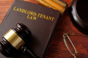 Book with title Landlord-Tenant Law and a gavel.
