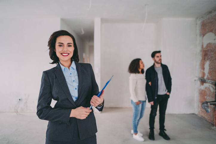 Real estate agent smiling to the camera